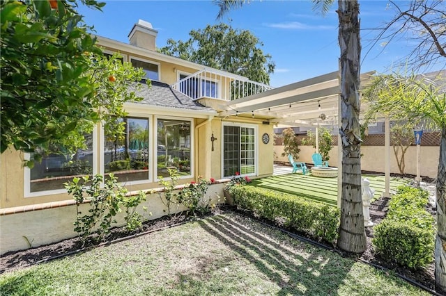 22839 Ridge Route Ln, Lake Forest, CA 92630 - rear view of property with stucco siding, a chimney, and fence