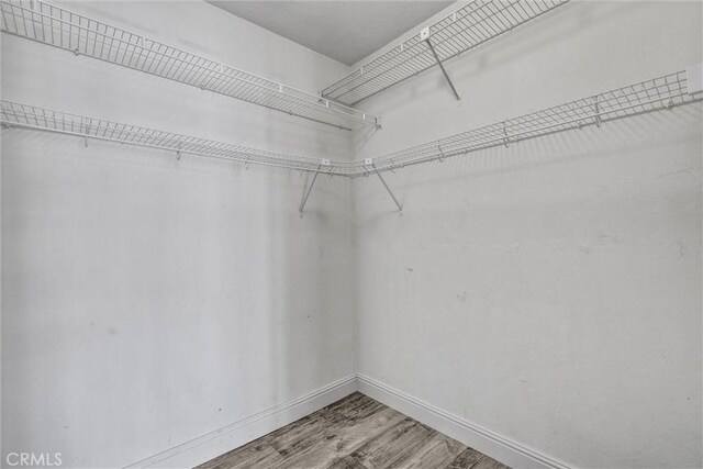 22839 Ridge Route Ln, Lake Forest, CA 92630 - walk in closet with wood finished floors