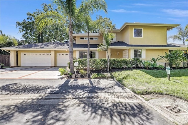 22839 Ridge Route Ln, Lake Forest, CA 92630 - view of front of house with a garage, driveway, a front yard, and stucco siding