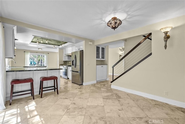 22839 Ridge Route Ln, Lake Forest, CA 92630 - living area with a raised ceiling, stairs, baseboards, and light tile patterned floors