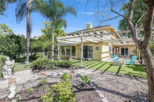 22839 Ridge Route Ln, Lake Forest, CA 92630 - rear view of house with a pergola, a chimney, a lawn, a patio, and stucco siding
