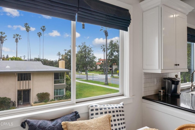 380 S Orange Grove Blvd Unit 6, Pasadena, CA 91105 - detailed view of backsplash, white cabinets, and dark countertops