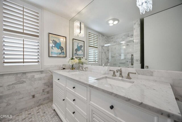 380 S Orange Grove Blvd Unit 6, Pasadena, CA 91105 - bathroom featuring double vanity, a shower stall, and tile walls