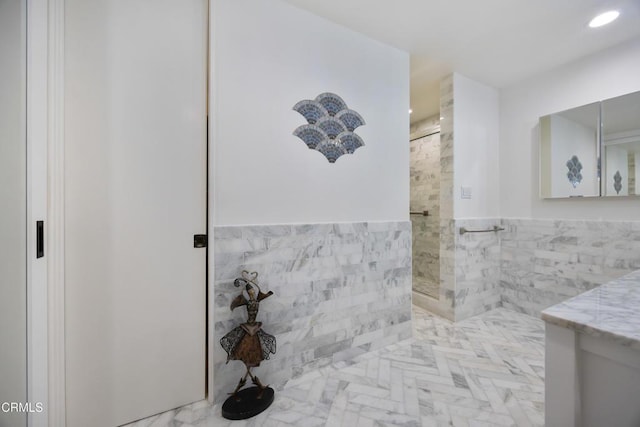 380 S Orange Grove Blvd Unit 6, Pasadena, CA 91105 - full bathroom featuring tile walls, tiled shower, vanity, recessed lighting, and a wainscoted wall