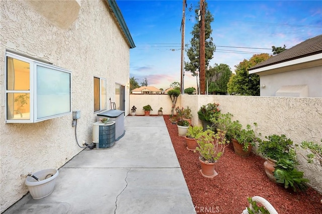 view of patio / terrace with a fenced backyard and central AC