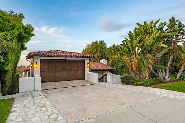 541 Via Del Monte, Palos Verdes Estates, CA 90274 - mediterranean / spanish-style house featuring a tiled roof, a garage, stucco siding, a chimney, and a gate