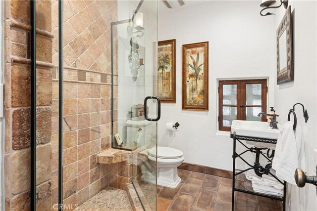 541 Via Del Monte, Palos Verdes Estates, CA 90274 - full bathroom featuring toilet, a stall shower, baseboards, french doors, and a sink
