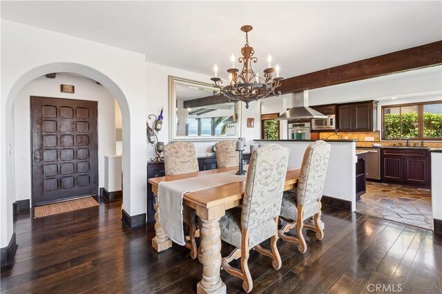 541 Via Del Monte, Palos Verdes Estates, CA 90274 - dining space featuring a chandelier, dark wood-style floors, and arched walkways