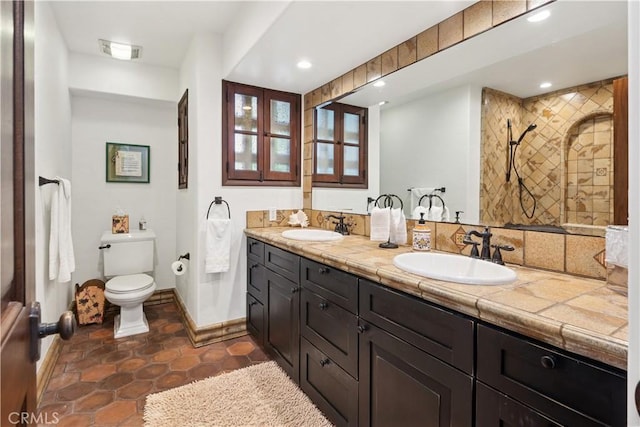 541 Via Del Monte, Palos Verdes Estates, CA 90274 - full bath with double vanity, toilet, baseboards, recessed lighting, and tile patterned floors