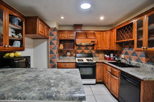 kitchen featuring black appliances, a sink, light tile patterned flooring, backsplash, and recessed lighting