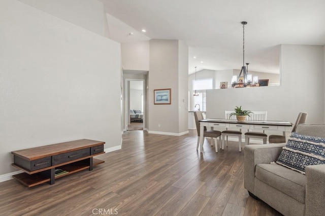 40049 Corte Fortuna, Murrieta, CA 92562 - dining space featuring vaulted ceiling, a chandelier, wood finished floors, recessed lighting, and baseboards
