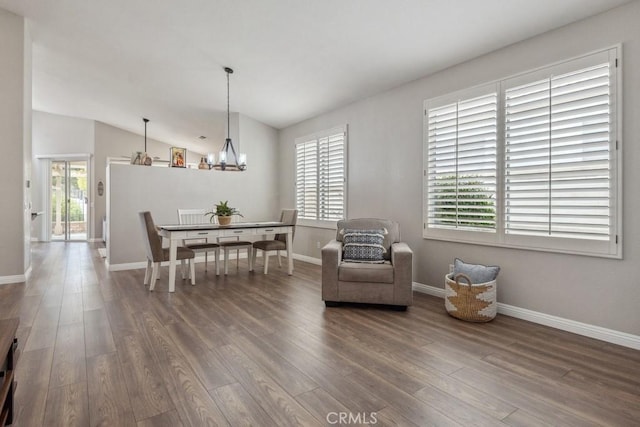 40049 Corte Fortuna, Murrieta, CA 92562 - dining room featuring wood finished floors, a chandelier, baseboards, and lofted ceiling