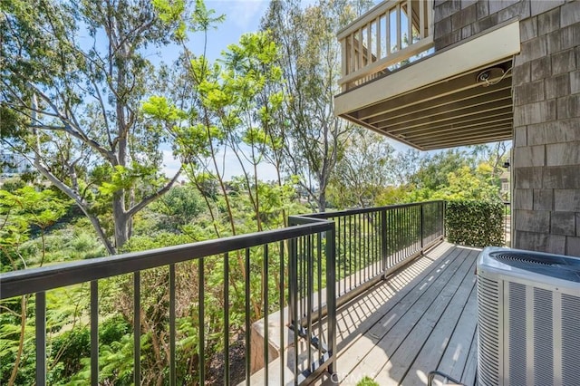 wooden deck with central air condition unit