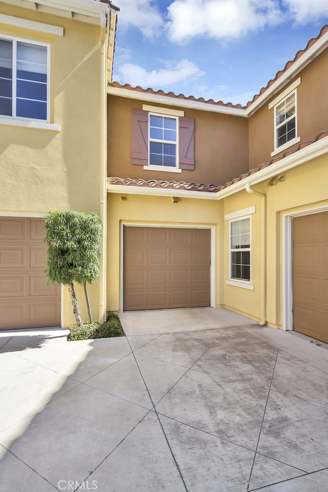 1510 Timberwood, Irvine, CA 92620 - multi unit property with a tile roof, stucco siding, and driveway
