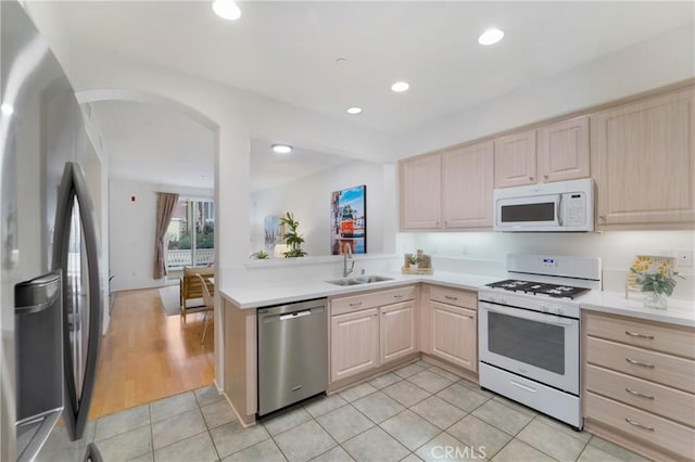 1510 Timberwood, Irvine, CA 92620 - kitchen with appliances with stainless steel finishes, light brown cabinets, a sink, light countertops, and light tile patterned floors