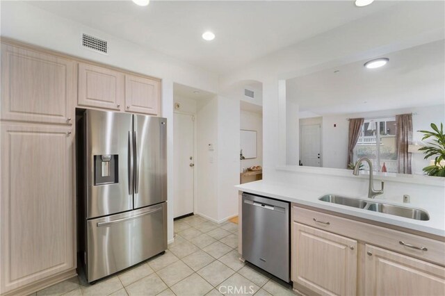 1510 Timberwood, Irvine, CA 92620 - kitchen with appliances with stainless steel finishes, light brown cabinetry, a sink, light countertops, and recessed lighting