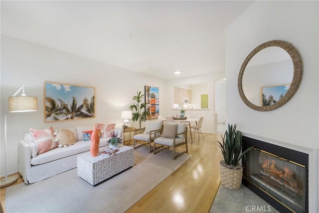 1510 Timberwood, Irvine, CA 92620 - living area featuring light wood-style flooring and a glass covered fireplace