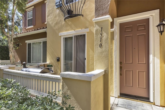 1510 Timberwood, Irvine, CA 92620 - doorway to property featuring stucco siding