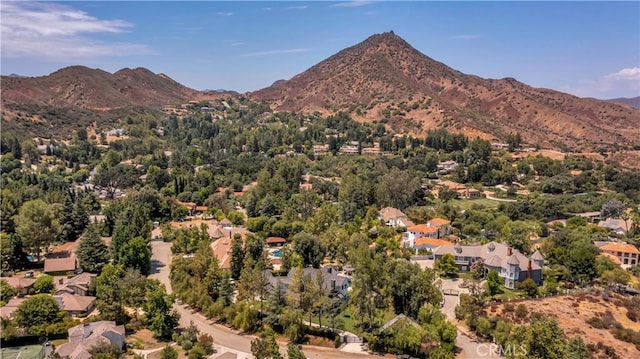 birds eye view of property with a mountain view