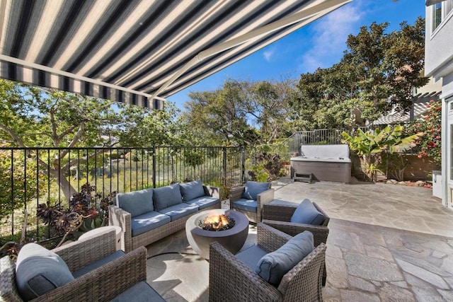 view of patio featuring area for grilling, an outdoor living space with a fire pit, and fence
