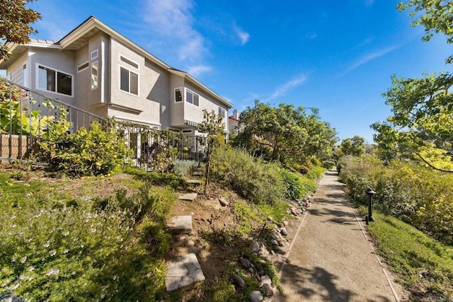 view of side of property with stucco siding