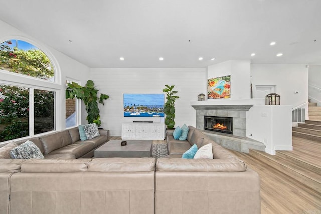 1164 Quail Gardens Ct, Encinitas, CA 92024 - living room with wood finished floors, a fireplace, recessed lighting, and stairs