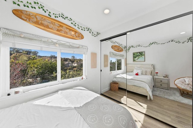 1164 Quail Gardens Ct, Encinitas, CA 92024 - bedroom featuring wood finished floors, recessed lighting, and a closet
