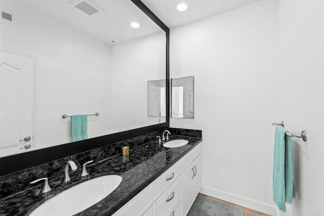 1164 Quail Gardens Ct, Encinitas, CA 92024 - bathroom with double vanity, baseboards, recessed lighting, and wood finished floors