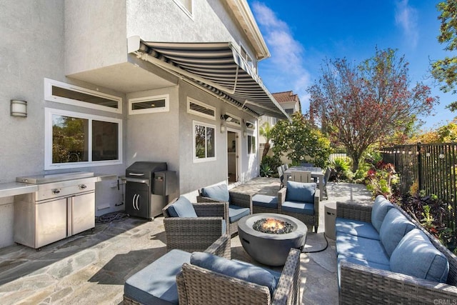 1164 Quail Gardens Ct, Encinitas, CA 92024 - fenced backyard featuring an outdoor living space with a fire pit, a patio area, and area for grilling