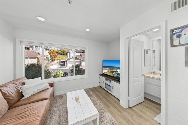 1164 Quail Gardens Ct, Encinitas, CA 92024 - living area featuring light wood-style flooring, recessed lighting, and baseboards