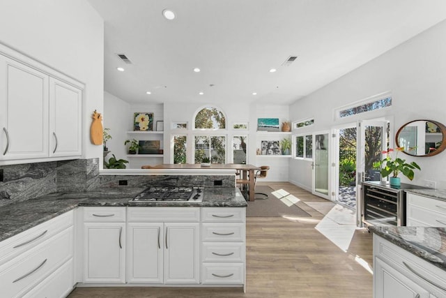 1164 Quail Gardens Ct, Encinitas, CA 92024 - kitchen featuring stainless steel gas cooktop, recessed lighting, a peninsula, white cabinets, and light wood-style floors