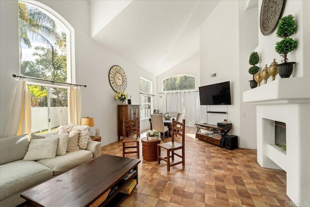 4981 Marin Dr, Oceanside, CA 92056 - living room featuring high vaulted ceiling, a glass covered fireplace, and visible vents