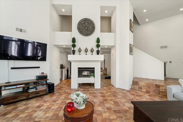 4981 Marin Dr, Oceanside, CA 92056 - living area with visible vents, recessed lighting, and a towering ceiling
