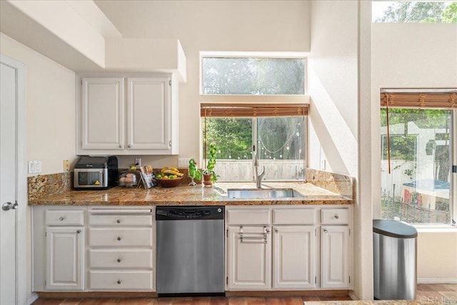 4981 Marin Dr, Oceanside, CA 92056 - kitchen featuring a sink, light stone counters, white cabinetry, and dishwasher