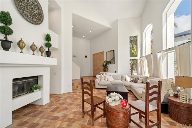 4981 Marin Dr, Oceanside, CA 92056 - living room with a glass covered fireplace and a towering ceiling