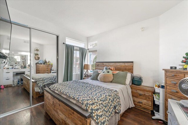 4981 Marin Dr, Oceanside, CA 92056 - bedroom with dark wood finished floors, visible vents, and a closet