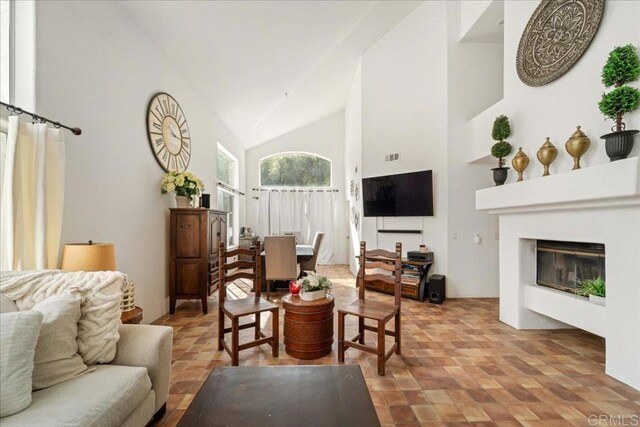4981 Marin Dr, Oceanside, CA 92056 - living area featuring a glass covered fireplace and high vaulted ceiling