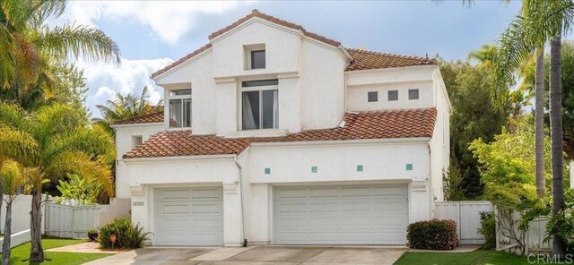4981 Marin Dr, Oceanside, CA 92056 - rear view of house with a tile roof, a garage, and concrete driveway
