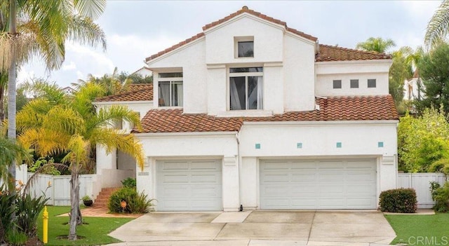 4981 Marin Dr, Oceanside, CA 92056 - view of front of property featuring a tiled roof, concrete driveway, and stucco siding