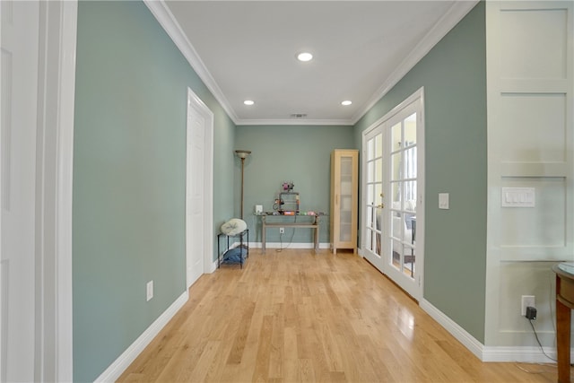 hallway with crown molding, recessed lighting, baseboards, light wood-style floors, and visible vents