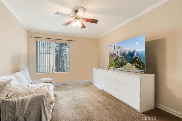 living area with baseboards, ceiling fan, crown molding, and carpet floors
