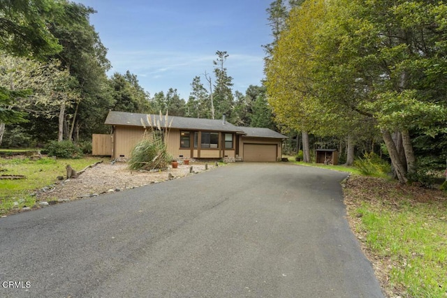 view of front of house featuring driveway and a garage