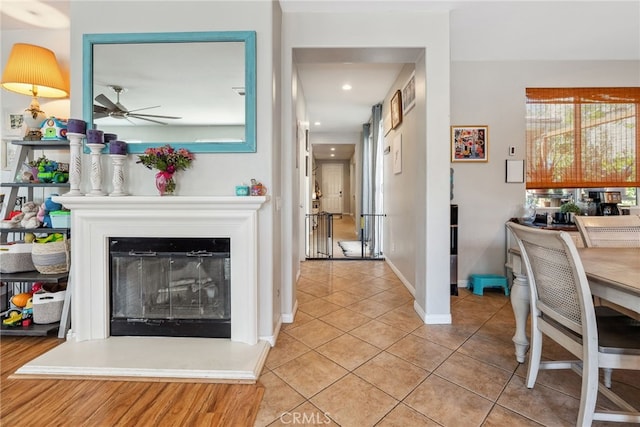 interior space with light tile patterned floors, a wealth of natural light, recessed lighting, and baseboards