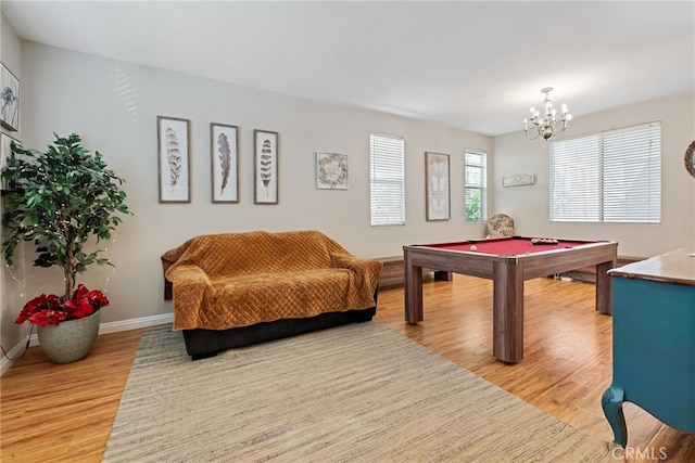 recreation room featuring billiards, an inviting chandelier, light wood-style floors, and baseboards