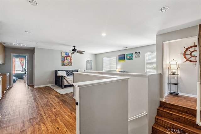 kitchen with open floor plan, a ceiling fan, and a healthy amount of sunlight