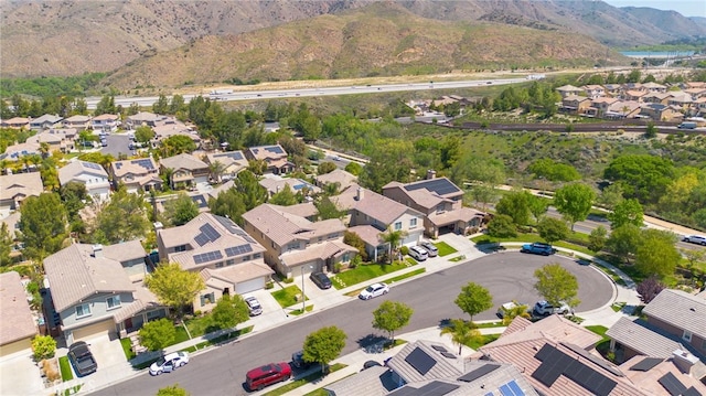 drone / aerial view featuring a residential view and a mountain view