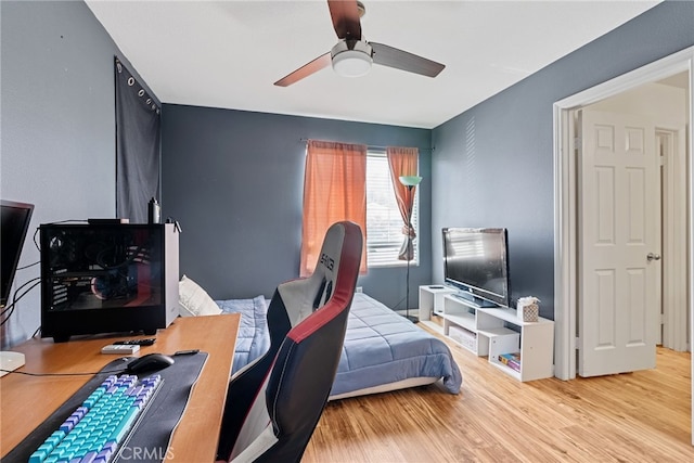 bedroom featuring ceiling fan and wood finished floors