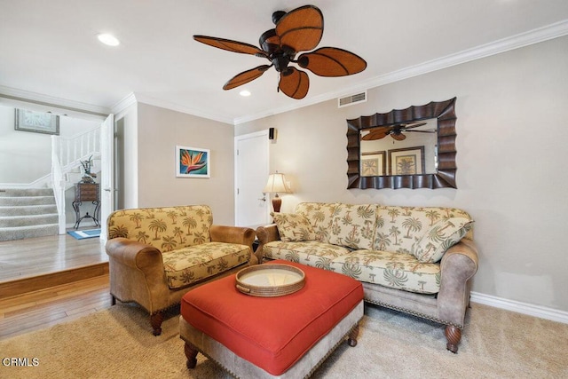 2231 Peninsula Rd, Oxnard, CA 93035 - living area with crown molding, stairs, baseboards, visible vents, and a ceiling fan