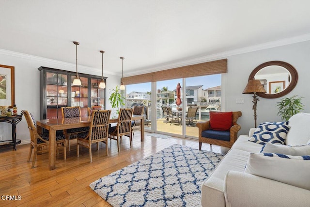 2231 Peninsula Rd, Oxnard, CA 93035 - dining space with crown molding and light wood-style floors