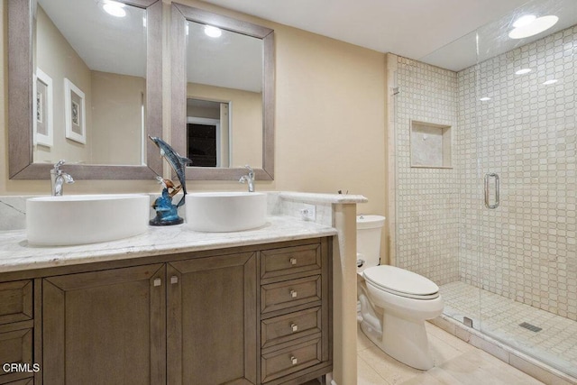 2231 Peninsula Rd, Oxnard, CA 93035 - bathroom with a sink, double vanity, toilet, and a stall shower